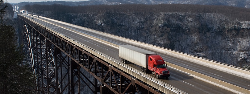 A trucker drives across The New River Gorge Bridge in Fayetteville, West Virginia.